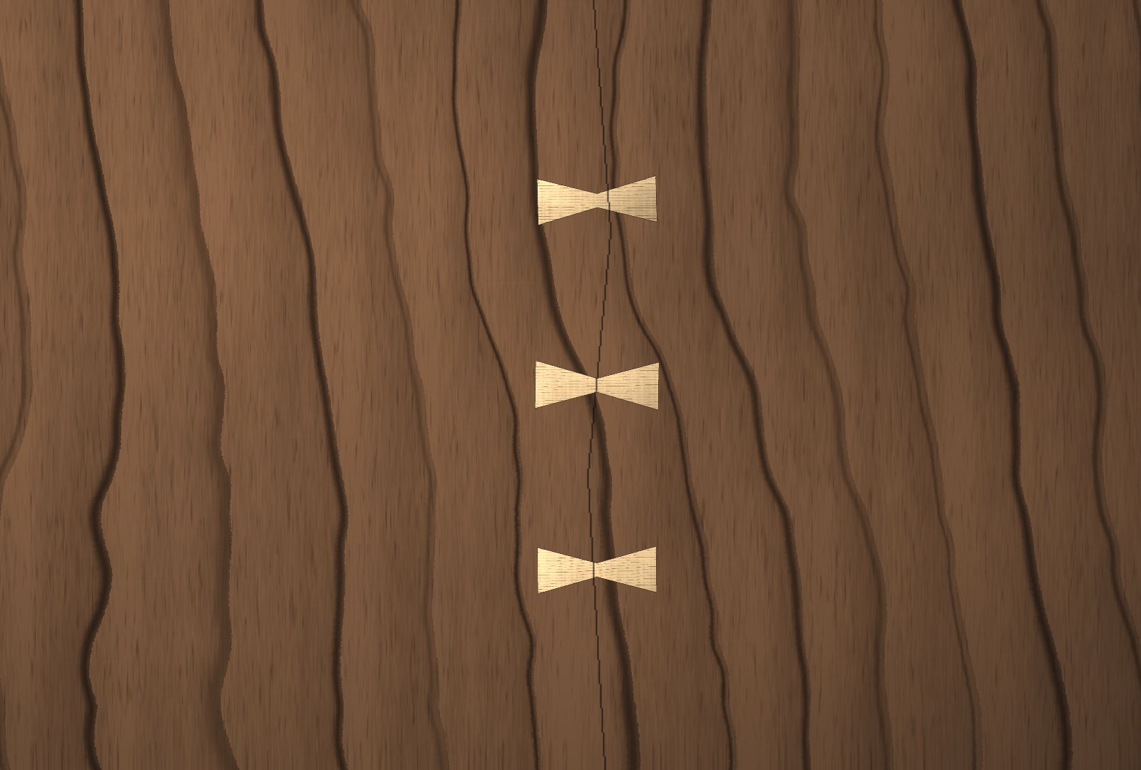 A black walnut top with three maple butterfly keys set down a single split